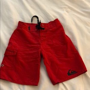 Red boys Quicksilver board shorts, size 6